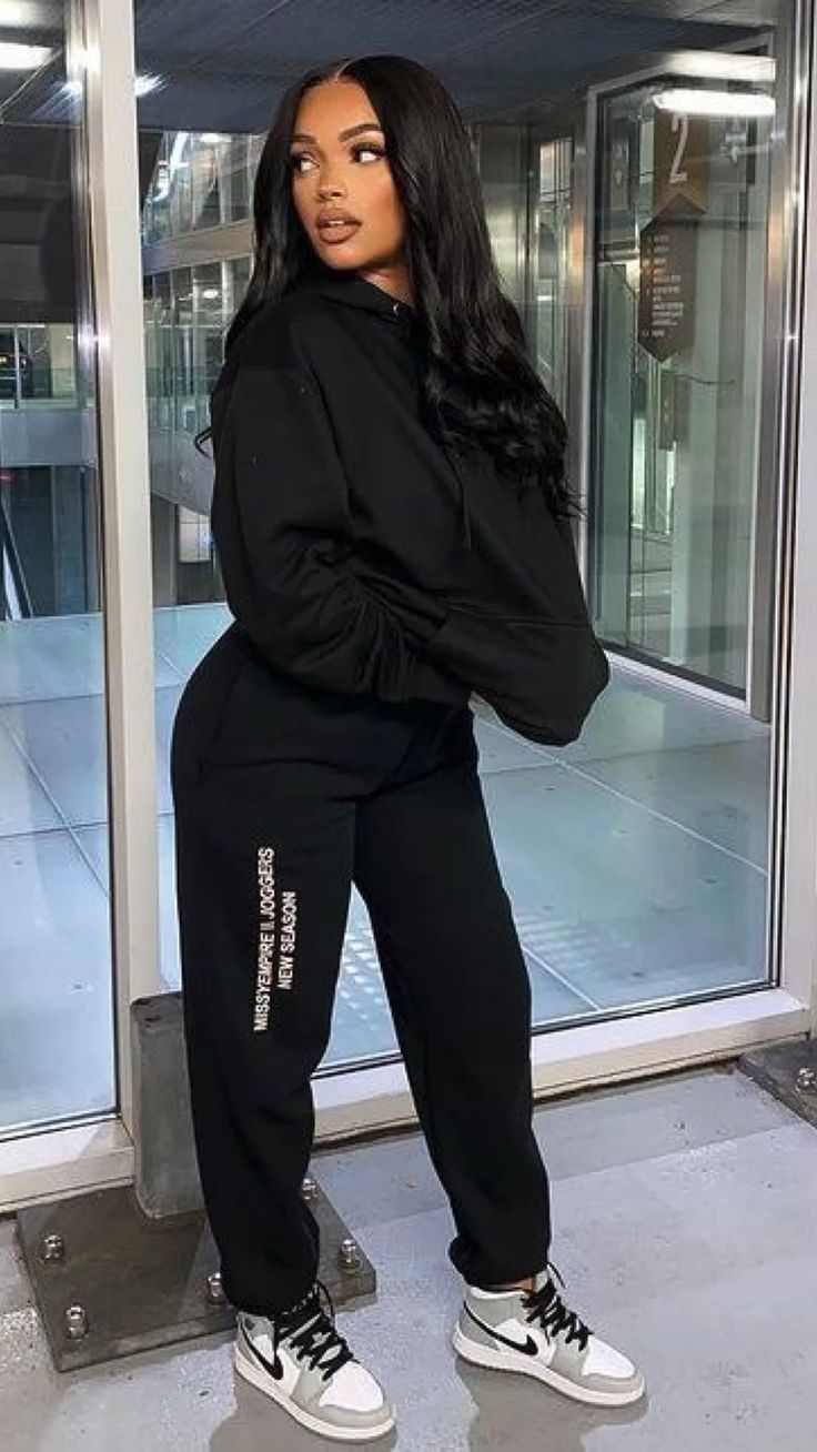 All-Black Tracksuit with White and Black Jordans